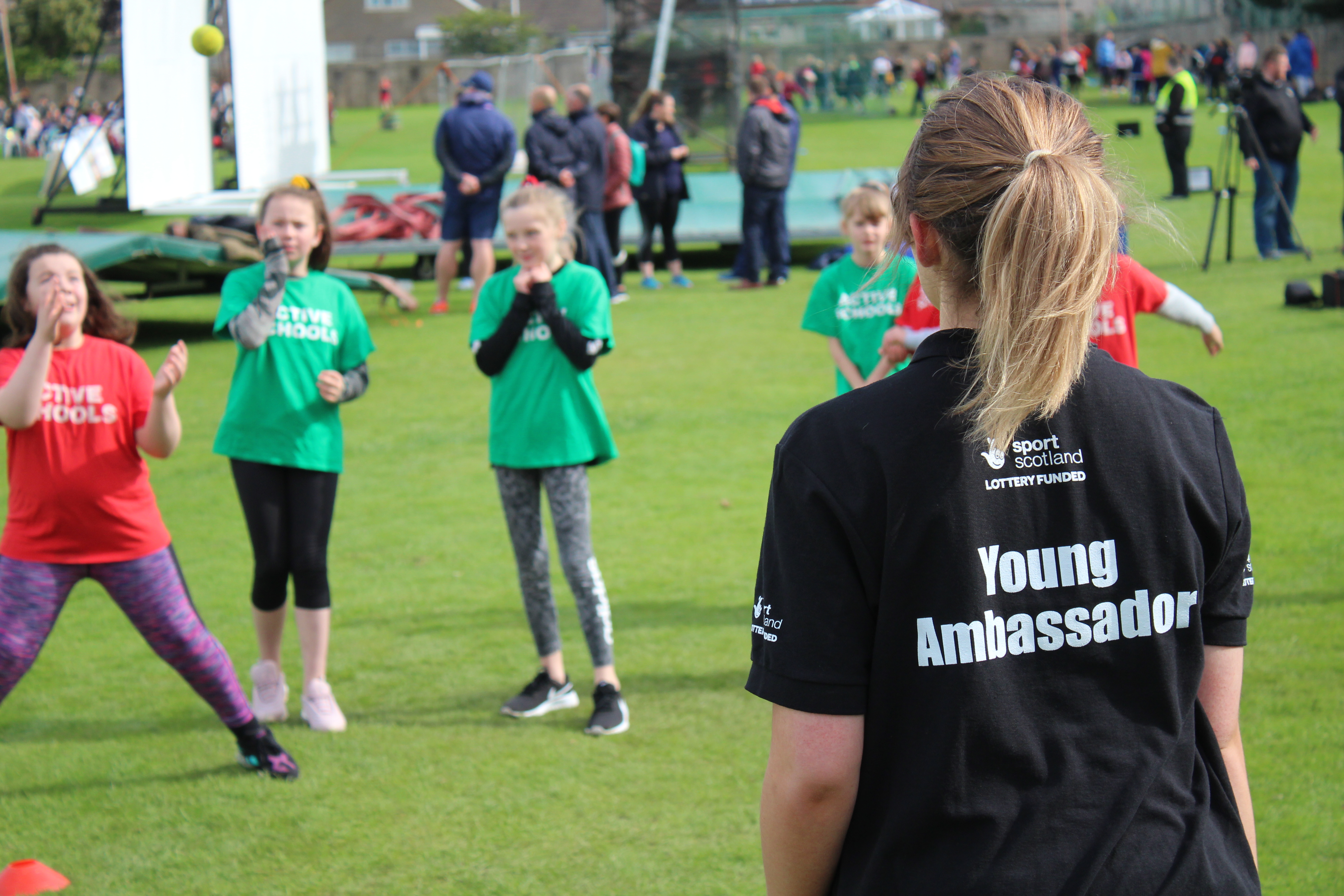 From behind, Young Ambassador, with kids in background
